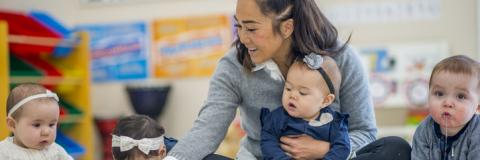 Teacher and Child Playing with Blocks