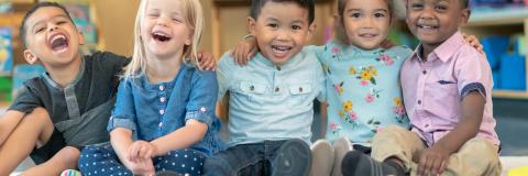 2023 Demographics Multiracial group of smiling preschoolers.
