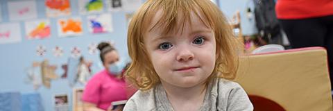 Child Care Scholarship 3 Happy red haired girl in quality child care.
