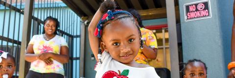 Little girl posing for the camera at her Early Head Start site. 