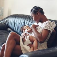 Mother cuddling with baby.