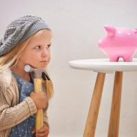 Girl ready to break piggy bank