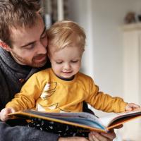 Father and son reading.