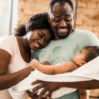 Parents celebrate the birth of a new baby.