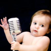 Baby with a microphone. 