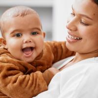 Happy Latino baby and mom. 