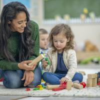Pre-K teacher and female student