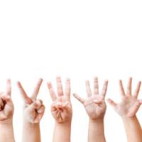 Child's hands signing numbers one through five 