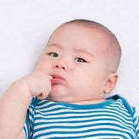 adorable baby looks like he's contemplating some bad decisions 