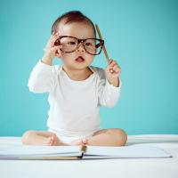 Infant wearing Dad's glasses 