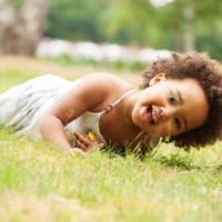 Young African-American girl is having fun outside 