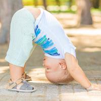 Baby doing Downward Facing Dog pose.  