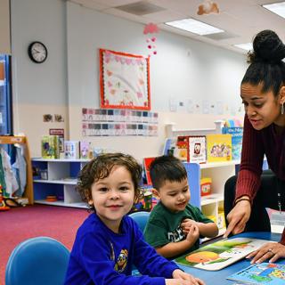 Two boys learning in a Family Support Center. 