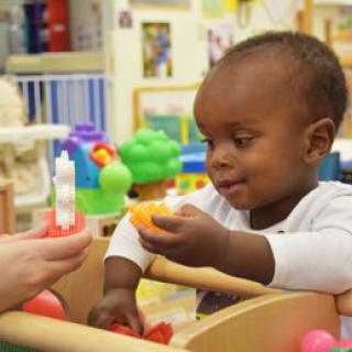 Building Blocks to Success - child playing with blocks