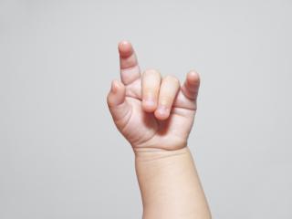 Baby using sign language.