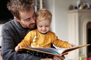 Father and son reading.