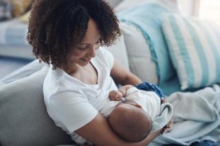 Breastfeeding and COVID Mom breastfeeding her baby.