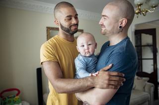 Two Happy Dads Two happy dads and their baby.