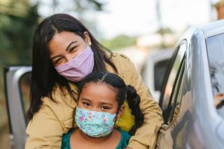 Generation Parentless Masked mom and young girl.