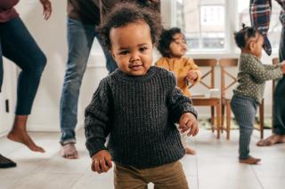 Toddler looking at the camera.