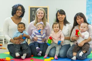 A diverse group of mothers and babies. 