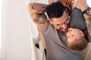 Father and toddler son playing. 