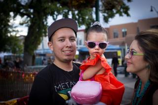 Young parents and toddler girl in sunglasses. 