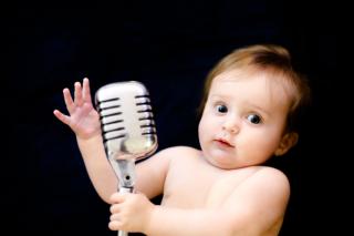 Baby with a microphone. 