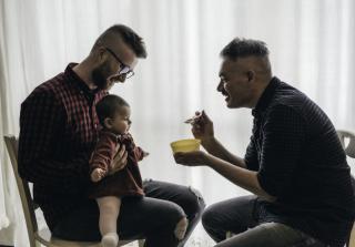 Proud Children Proud Parents Two dads feeding their babies.