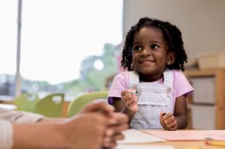 Little girl smiling at child care. 