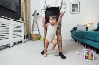 Parent walking with a child who has special cognitive needs. 