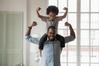 Father and son showing how strong they are.