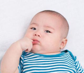 adorable baby looks like he's contemplating some bad decisions