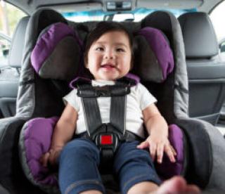 Baby sitting in car seat, ready to go for a ride!