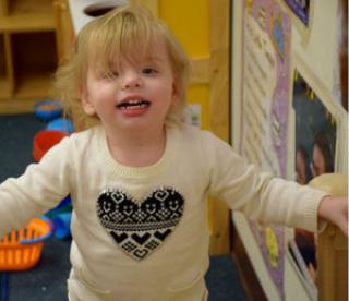 Blonde toddler girl in child care setting 
