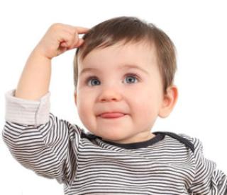 Baby in a thinking pose having an idea