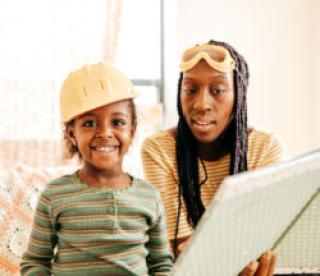 Mom and daughter reading a book 