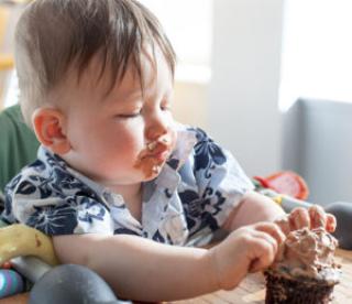 boy eating a birthday cake