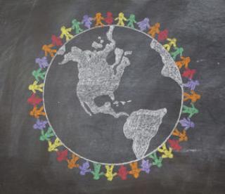 a hand drawn chalkboard shows multi-racial people holding hands around the world to show care for the earth, peace, and unity