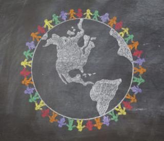 a hand drawn chalkboard shows multi-racial people holding hands around the world to show care for the earth, peace, and unity 