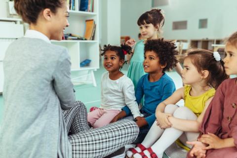 Teacher and children in child care