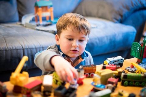 Boy Playing With Toys