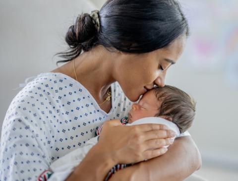 2025 Demographics Mom and newborn baby being close.